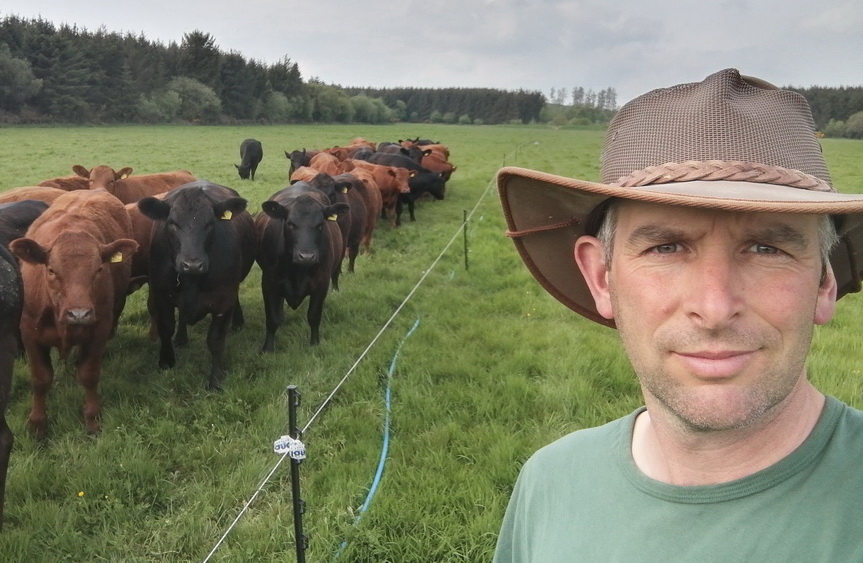 Photo of farmer, Duncan Bennett, with his cattle