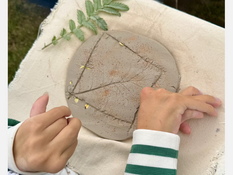 participant working with clay